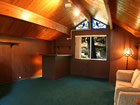 mountain cabin loft with stained glass windows.