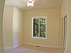 guest room with mirrored closet.